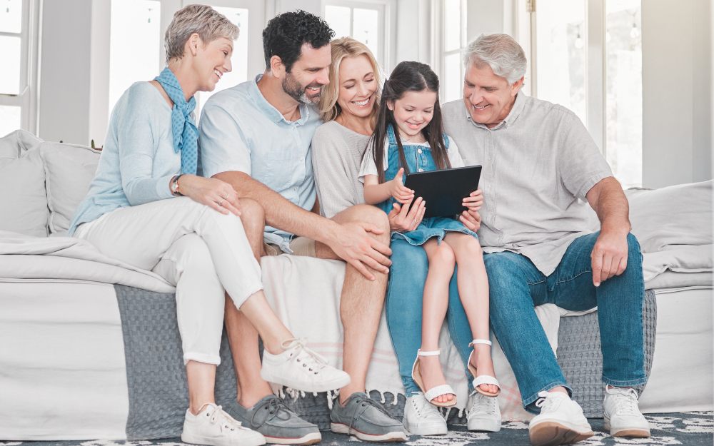 family sit with tablet